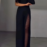Yksiolkaiminen elegantti haalari, jossa on näyttäviä yksityiskohtia